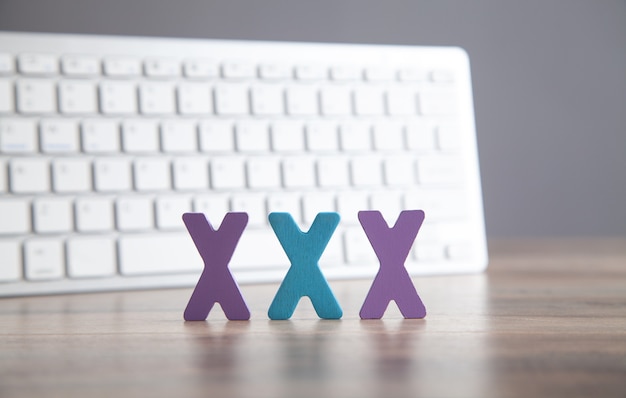 Computer keyboard with a XXX symbols.