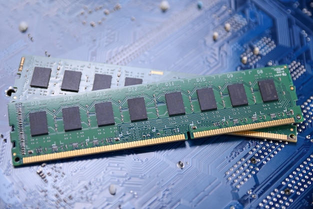 Computer memory RAM on motherboard background . Close up. system, main memory, random access memory, onboard, computer detail. Computer components . DDR3. DDR4. DDR5