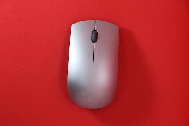 Computer mouse on solid color background