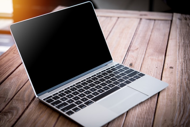 computer notebook on wood table