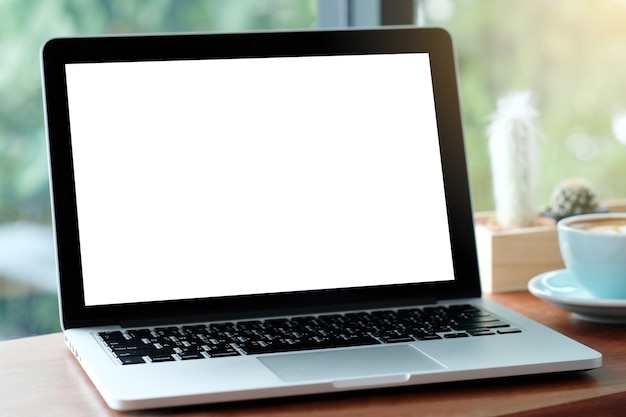 computer with blank screen on wood table