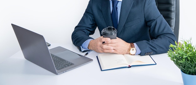 Concentrated mature man has video call in business office