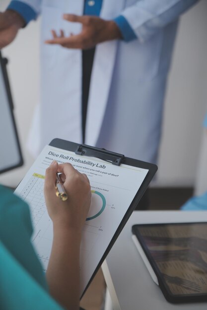 Concentrated medical team using laptop together in the office