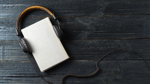 Concept audio books on a dark wooden table