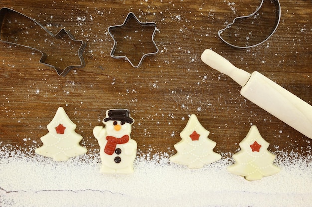 Concept for baking with flour and cookies wooden background