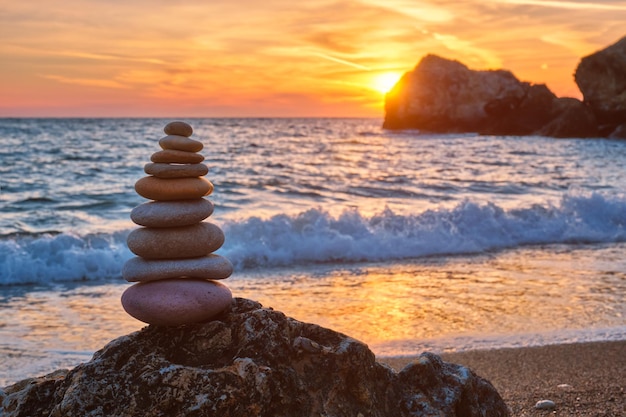 Concept of balance and harmony stone stack on the beach