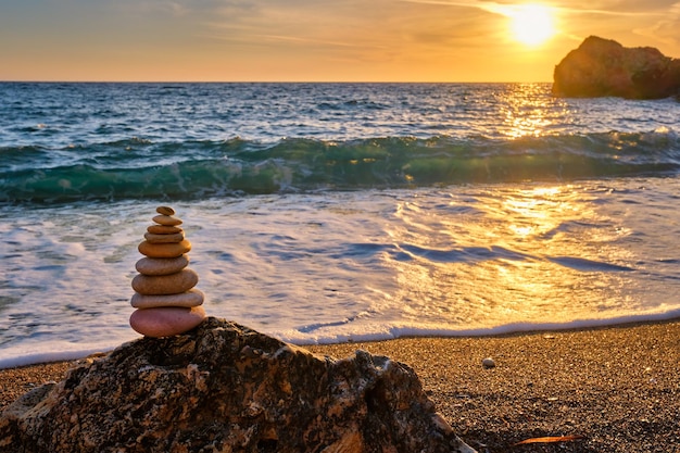 Concept of balance and harmony stone stack on the beach