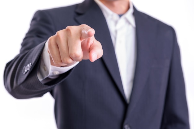 Concept business or financial  : Asian business man points his finger to introduce or order of appoint something isolated on white background.