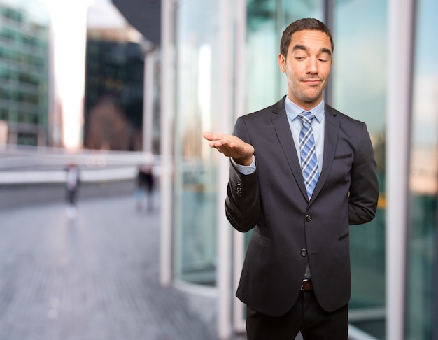 Concept of a businessman showing something with his hand