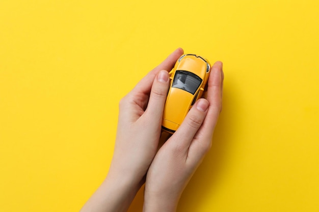 Concept of car purchase and insurance with toy car