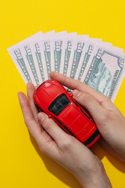 Concept of car purchase and insurance with toy car