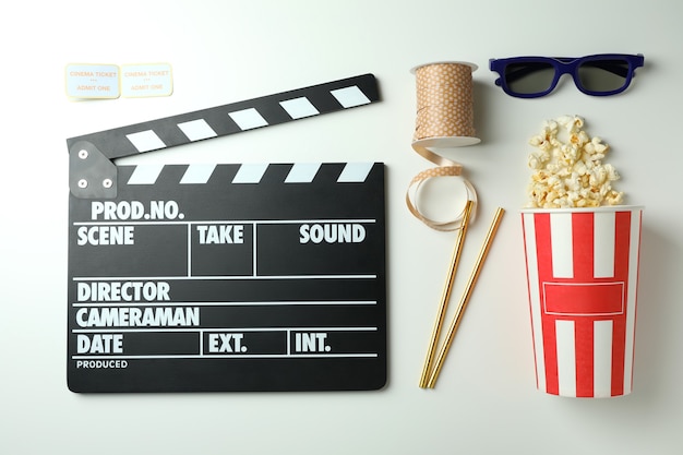 Concept of cinema accessories on light background.