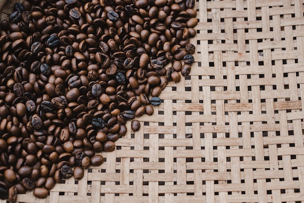 Concept Coffee: The roasted coffee beans are then placed on a wooden net to cool down.