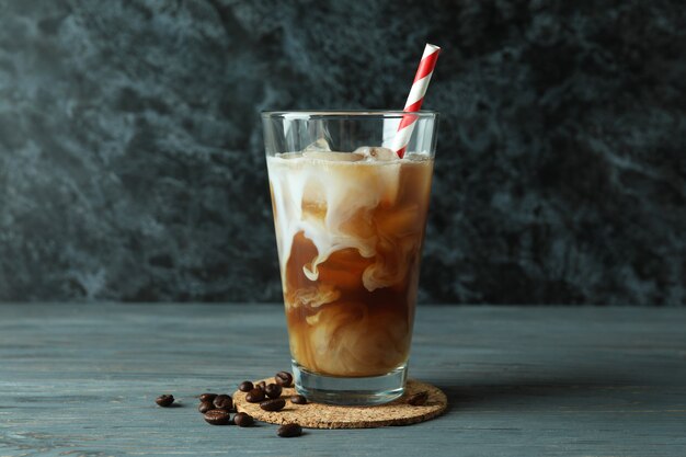 Concept of cold drink with ice coffee on wooden table