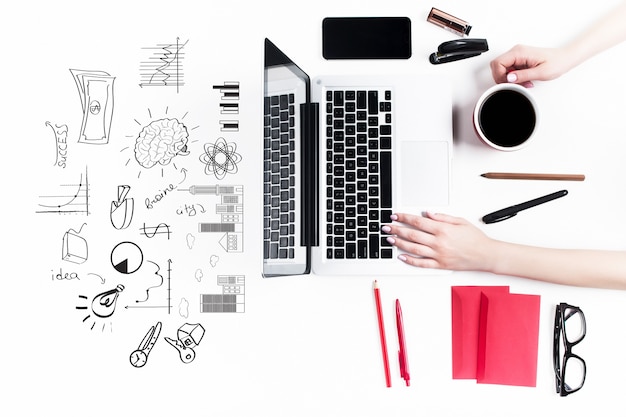 Concept of comfortable female workplaces. Gadgets on the white desk