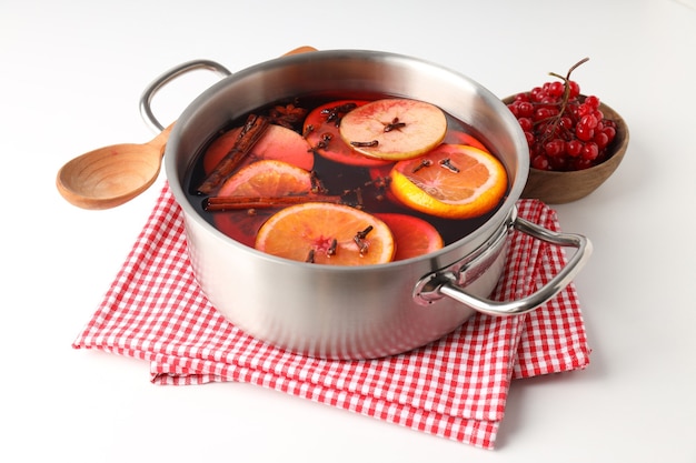 Concept of cooking  mulled wine on white background