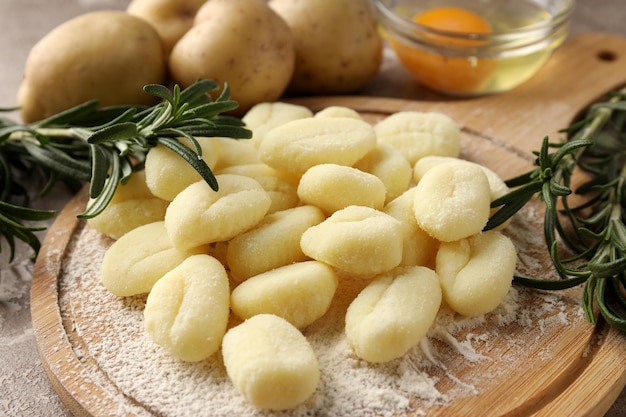 Concept of cooking with raw potato gnocchi close up