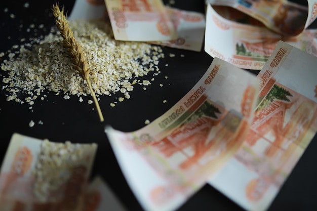 The concept of the cost of grain 5000 ruble banknotes around a handful of ground grain World hunger