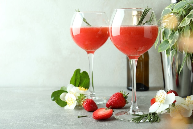 Concept of delicious drink with Rossini cocktail on gray textured table