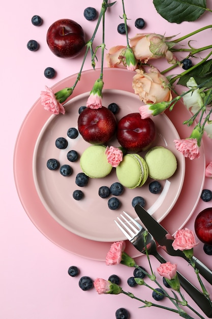 Concept of delicious eating on pink background