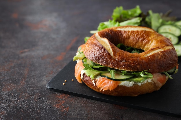 Concept of delicious food tasty bagel sandwich space for text