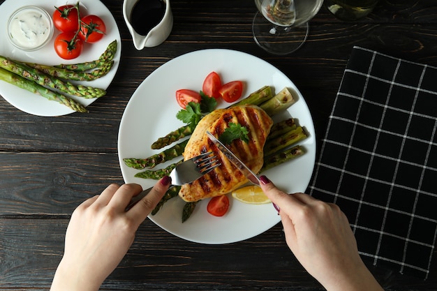 Concept of delicious food with grilled chicken meat on wooden table