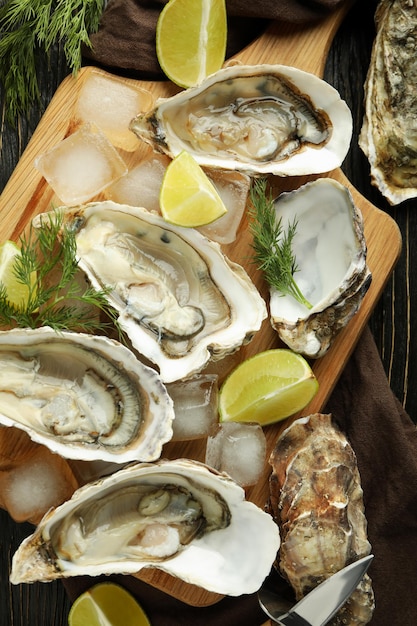 Concept of delicious seafood oysters on wooden table