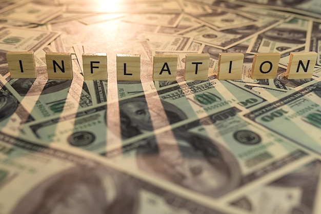 The concept of financial inflation Inflation letters on dollars with shadow