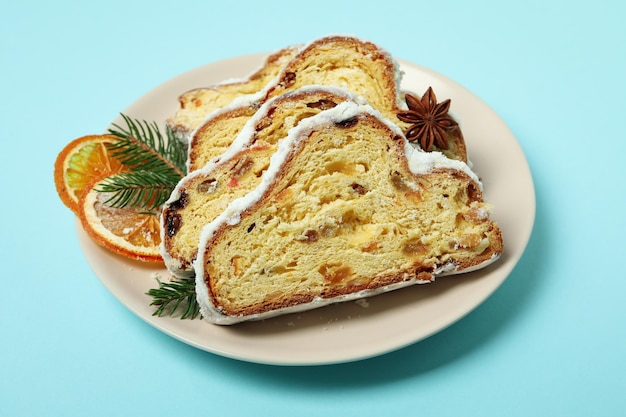 Concept of German dessert Stollen on blue background