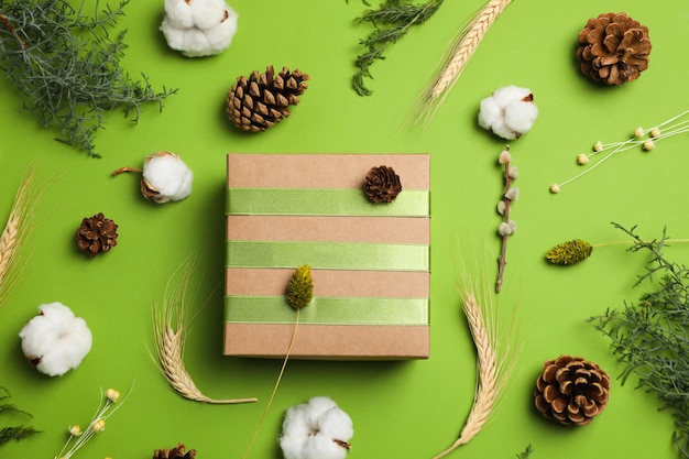 Concept of gift gift box and accessories on green background