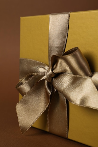 Concept of gift gift box on brown background