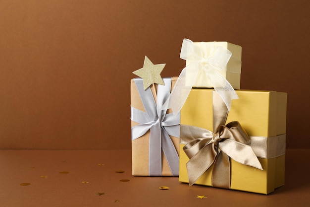 Concept of gift gift boxes on brown background