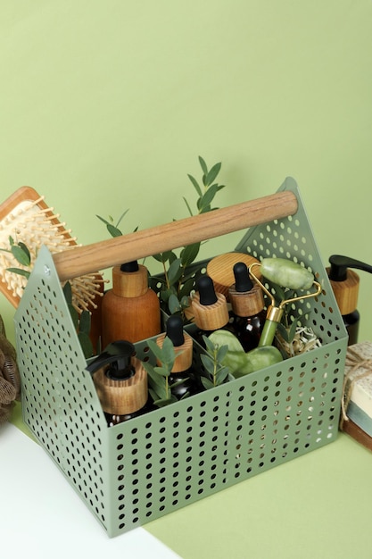 Concept of gift with basket of cosmetics on two- color background