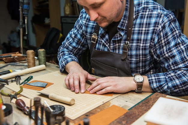 Concept of handmade craft production of leather goods.