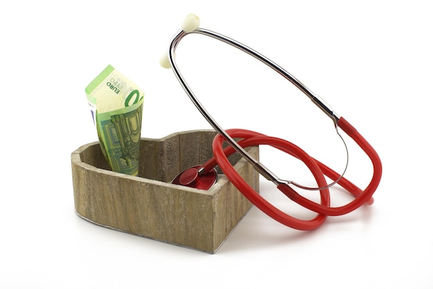 Concept of healthcare and medical costs with stethoscope and euro banknotes money with copy space