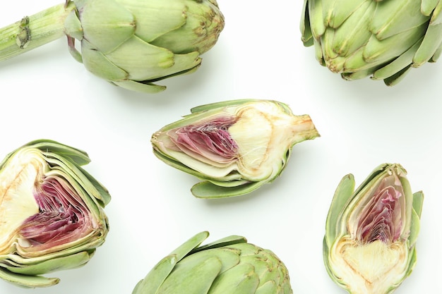 Concept of healthy food with artichoke on white background