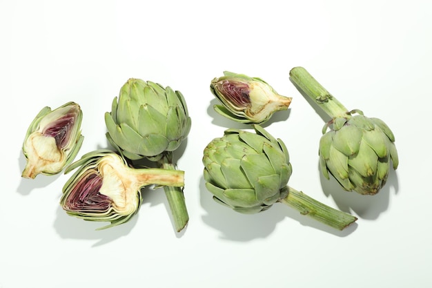 Concept of healthy food with artichoke on white background