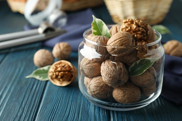 Concept of healthy food with walnuts on wooden background