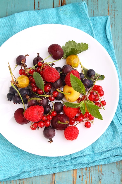 Concept of healthy vegan dessert, raspberry, cherry, red currant. Selective focus