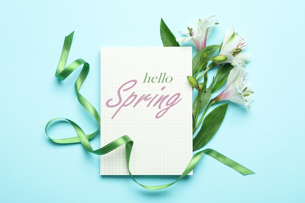 Concept of "Hello Spring" on blue background