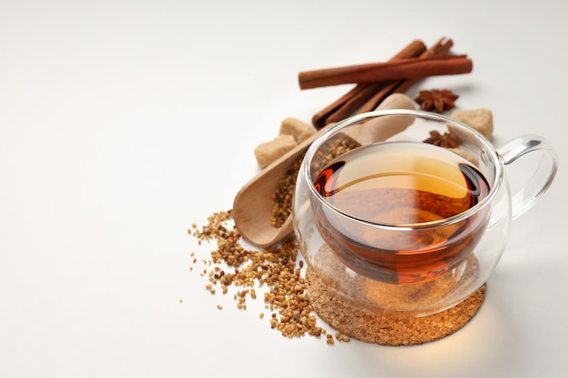 Concept of hot drink with tea on white background