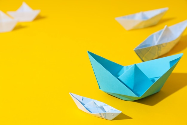 Concept of leadership and business with paper boats