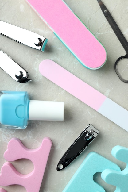 Concept of nail care with manicure accessories on light textured background