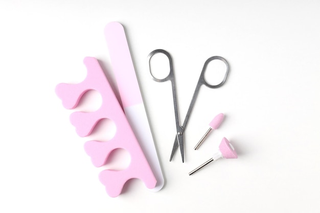 Concept of nail care with manicure accessories on white background