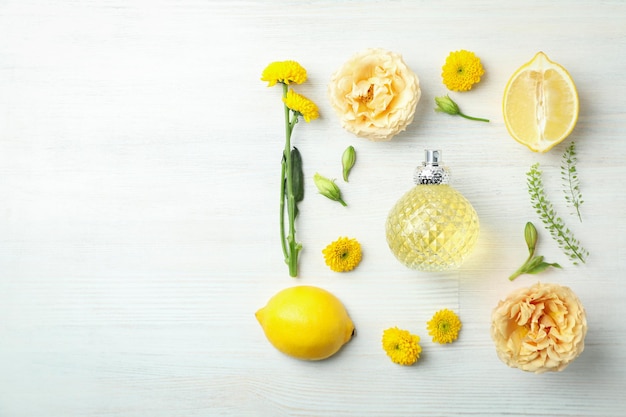 Concept of natural perfume on white wooden table