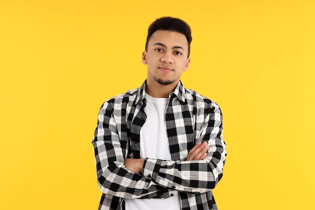 Concept of people with young man on yellow background