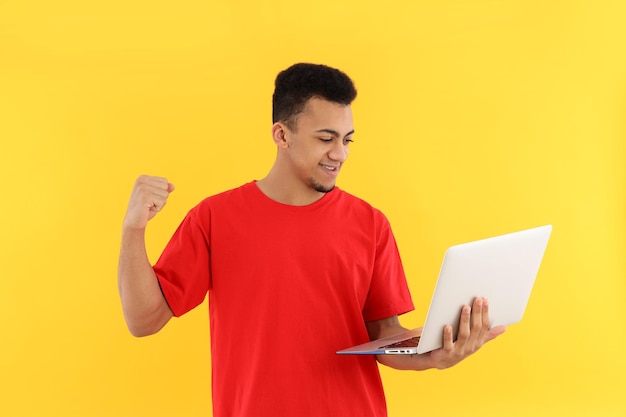 Concept of people with young man on yellow background