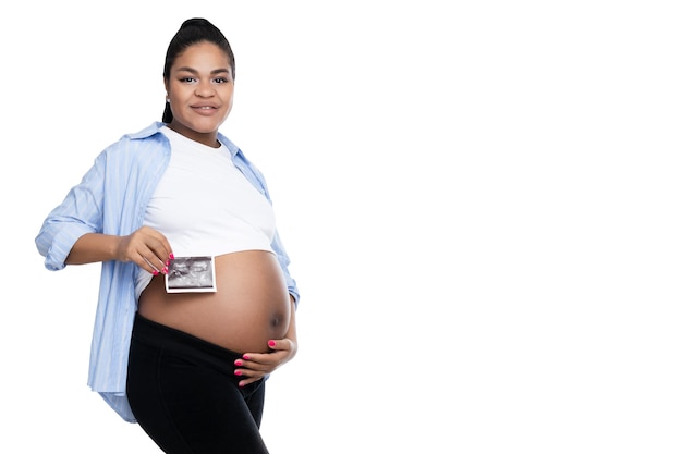 Concept of pregnancy and maternity with african american woman isolated on white background