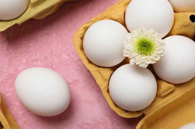 Concept of spring eggs with flowers top view