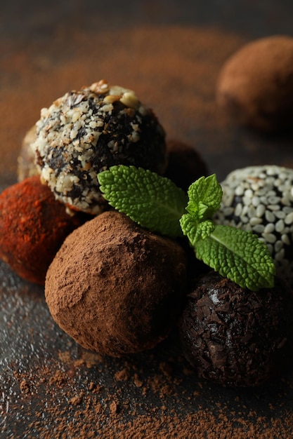 Concept of sweets with truffles on dark textured background